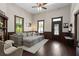 Spacious living room with dark wood floors, a fireplace, and comfortable seating, perfect for entertaining at 161 N Barton St, Norcross, GA 30071