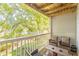Relaxing balcony with a scenic view, outdoor seating, and a serene atmosphere at 215 Cobblestone Trl, Avondale Estates, GA 30002