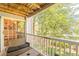 Relaxing balcony with scenic view, features comfortable seating, and sliding glass door at 215 Cobblestone Trl, Avondale Estates, GA 30002