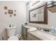 A bathroom with cabinets and a vanity mirror at 215 Cobblestone Trl, Avondale Estates, GA 30002