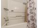 Bathroom tub with patterned shower curtain and built in shelving at 215 Cobblestone Trl, Avondale Estates, GA 30002