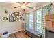 A bedroom is decorated with unique wall art, hardwood floors, and natural light at 215 Cobblestone Trl, Avondale Estates, GA 30002