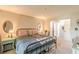 Bedroom featuring bright windows and access to closets and bathrooms at 215 Cobblestone Trl, Avondale Estates, GA 30002