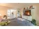 Bedroom with carpet and a large flat-screen TV in addition to furnishings and a bathroom nearby at 215 Cobblestone Trl, Avondale Estates, GA 30002