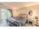 Cozy bedroom featuring a balcony with lots of natural light, plush carpet, and a comfortable double bed at 215 Cobblestone Trl, Avondale Estates, GA 30002