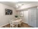 The dining area features hardwood floors, a modern chandelier, and an enclosed cabinet at 215 Cobblestone Trl, Avondale Estates, GA 30002