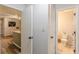 Hallway showing kitchen, hall closet, and ensuite bathroom at 215 Cobblestone Trl, Avondale Estates, GA 30002