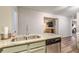 Kitchen sink and dishwasher with granite countertops and view into living area at 215 Cobblestone Trl, Avondale Estates, GA 30002
