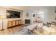 Open living room featuring a fireplace, TV, and hardwood floors at 215 Cobblestone Trl, Avondale Estates, GA 30002