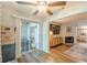 Sunroom offers a ceiling fan, backyard access, and leads into the living room at 215 Cobblestone Trl, Avondale Estates, GA 30002