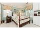 Cozy bedroom showcasing a four-poster bed, matching curtains, and built-in cabinets at 3099 Farmington Se Dr, Atlanta, GA 30339