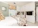 Bedroom featuring custom built in storage surrounding a four-poster bed and a window at 3099 Farmington Se Dr, Atlanta, GA 30339