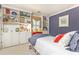 Comfortable bedroom featuring custom built in storage and a window seat beneath the window at 3099 Farmington Se Dr, Atlanta, GA 30339