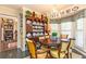 Charming dining area with hardwood floors, a decorative chandelier, and natural light at 3099 Farmington Se Dr, Atlanta, GA 30339