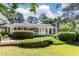 Lovely home with a well-kept lawn, a stone accent wall, and lush landscaping, offering great curb appeal at 3099 Farmington Se Dr, Atlanta, GA 30339
