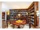 Elegant library with custom bookshelves, hardwood floors, and a cozy atmosphere at 3099 Farmington Se Dr, Atlanta, GA 30339