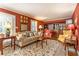 Beautiful living room with classic furniture, hardwood floors, and a large window with shutters at 3099 Farmington Se Dr, Atlanta, GA 30339