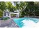 Beautiful backyard pool area with a pool house, lounge chairs, and privacy fencing, perfect for outdoor relaxation at 3099 Farmington Se Dr, Atlanta, GA 30339