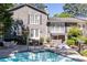 Exterior view of the backyard pool area with seating and lounge chairs for a relaxing outdoor experience at 3099 Farmington Se Dr, Atlanta, GA 30339