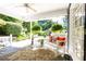 Inviting covered porch with slate flooring, bench seating, and lush greenery, creating a serene outdoor living space at 3099 Farmington Se Dr, Atlanta, GA 30339