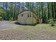 Back exterior of a home with a two-car garage and a deck accessible by a stairway at 4066 Covered Bridge Sw Rd, Smyrna, GA 30082