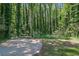 Private wooded backyard with a concrete pad is ideal for relaxing and outdoor activities at 4066 Covered Bridge Sw Rd, Smyrna, GA 30082