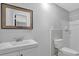 Clean bathroom with double sinks, sleek fixtures, and a tiled shower area at 4066 Covered Bridge Sw Rd, Smyrna, GA 30082