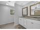 Bathroom featuring double vanity, granite countertops, modern fixtures, and tile flooring at 4066 Covered Bridge Sw Rd, Smyrna, GA 30082