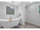 Modern bathroom featuring a luxurious soaking tub, shower, and built in shelving at 4066 Covered Bridge Sw Rd, Smyrna, GA 30082