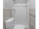Bathroom featuring a toilet and shower with tiled walls at 4066 Covered Bridge Sw Rd, Smyrna, GA 30082
