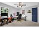 Bedroom with a ceiling fan, natural light, and a gamer's desk setup at 4066 Covered Bridge Sw Rd, Smyrna, GA 30082