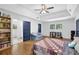 Bright bedroom with hardwood floors, natural light, and a well-stocked bookshelf at 4066 Covered Bridge Sw Rd, Smyrna, GA 30082