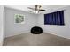Neutrally decorated bedroom with carpet, beanbag chair, window, and ceiling fan offering a cozy atmosphere at 4066 Covered Bridge Sw Rd, Smyrna, GA 30082
