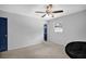Bedroom with light gray walls, light carpet and a ceiling fan, creating a simple and comfortable space at 4066 Covered Bridge Sw Rd, Smyrna, GA 30082
