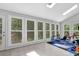 Sun-filled bonus room with large windows overlooking lush backyard at 4066 Covered Bridge Sw Rd, Smyrna, GA 30082