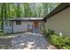 View of the facade of the home, featuring a brick entryway and a brick driveway approach at 4066 Covered Bridge Sw Rd, Smyrna, GA 30082