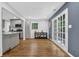 Bright kitchen with open layout, gray cabinetry, and views to the backyard at 4066 Covered Bridge Sw Rd, Smyrna, GA 30082