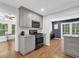 Charming kitchen features gray cabinets, granite countertops, and stainless steel appliances at 4066 Covered Bridge Sw Rd, Smyrna, GA 30082