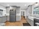 Stylish kitchen boasts gray cabinets, granite countertops, and hardwood flooring at 4066 Covered Bridge Sw Rd, Smyrna, GA 30082