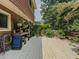 Deck with a variety of plants, blue chair, and bench at 410 Hunters Cove Ct, Lawrenceville, GA 30044
