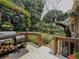 Deck with barbeque grill, firewood, and landscaped backyard at 410 Hunters Cove Ct, Lawrenceville, GA 30044