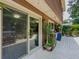 Home exterior displaying a covered deck, with plants and sliding glass doors at 410 Hunters Cove Ct, Lawrenceville, GA 30044