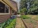 A well maintained yard with stone path to the back of the home showcasing an outdoor living space at 410 Hunters Cove Ct, Lawrenceville, GA 30044