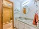 Updated bathroom featuring granite countertops, tiled shower, and stone floor at 410 Hunters Cove Ct, Lawrenceville, GA 30044