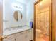 Well-lit bathroom with granite countertop vanity and shower/tub combo at 410 Hunters Cove Ct, Lawrenceville, GA 30044