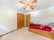 Bright bedroom with ceiling fan and closet at 410 Hunters Cove Ct, Lawrenceville, GA 30044