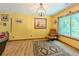 Well-lit dining area with wood-look flooring, a hanging light fixture, and a cozy feel at 410 Hunters Cove Ct, Lawrenceville, GA 30044