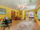 Open-concept living area seamlessly connects the kitchen and dining spaces with wood floors and natural light at 410 Hunters Cove Ct, Lawrenceville, GA 30044