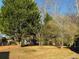 Spacious backyard with mature trees providing ample shade at 4756 Manly Ct, Stone Mountain, GA 30088