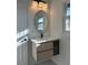 Stylish bathroom featuring modern vanity with a vessel sink, an ornate mirror, and contemporary lighting at 4756 Manly Ct, Stone Mountain, GA 30088